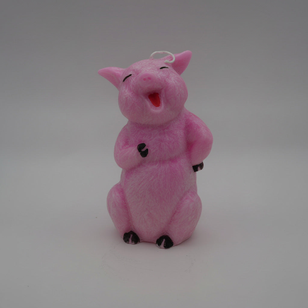 happy pig candle on a gray background