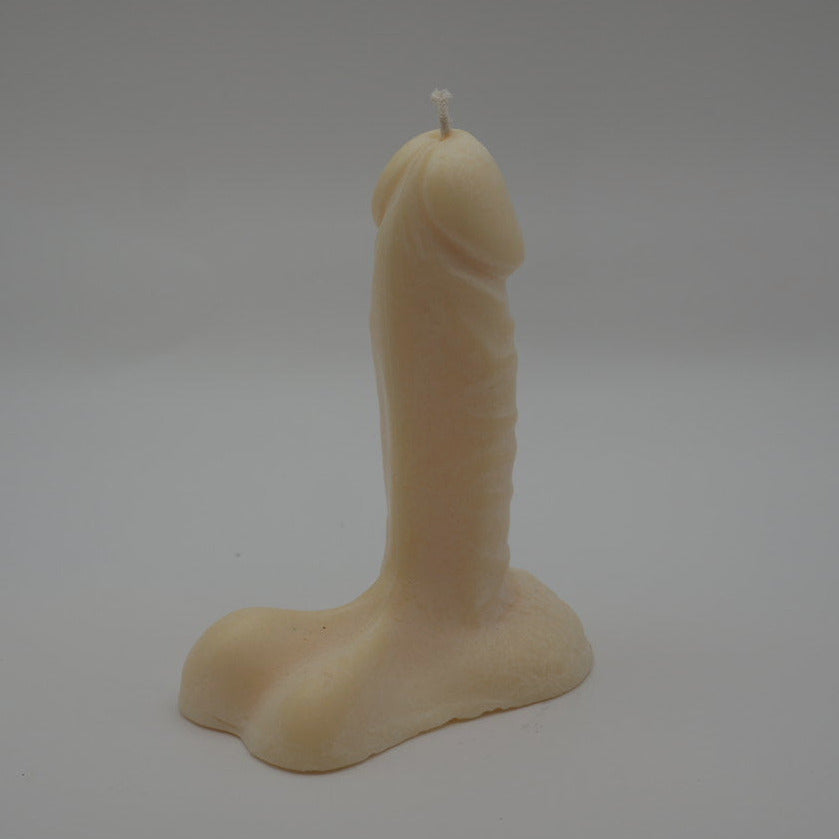 natural colored 6 inch penis candle with light grey background