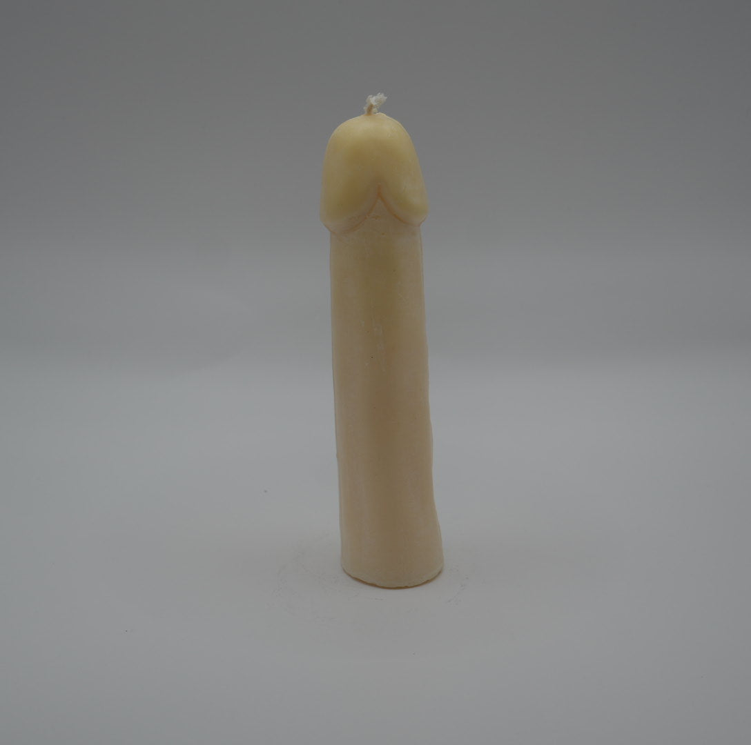 white penis pillar candle on light grey background