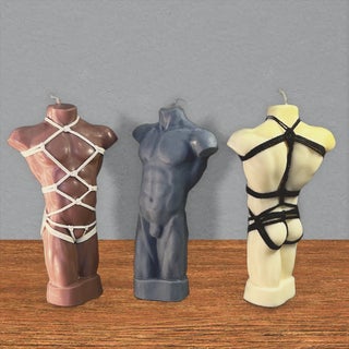 3 torso candles, 1 in brown, 1 grey, and 1 white. 2 have shibari
