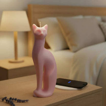 pink modern cat candle on a nightstand with a cat image and phone