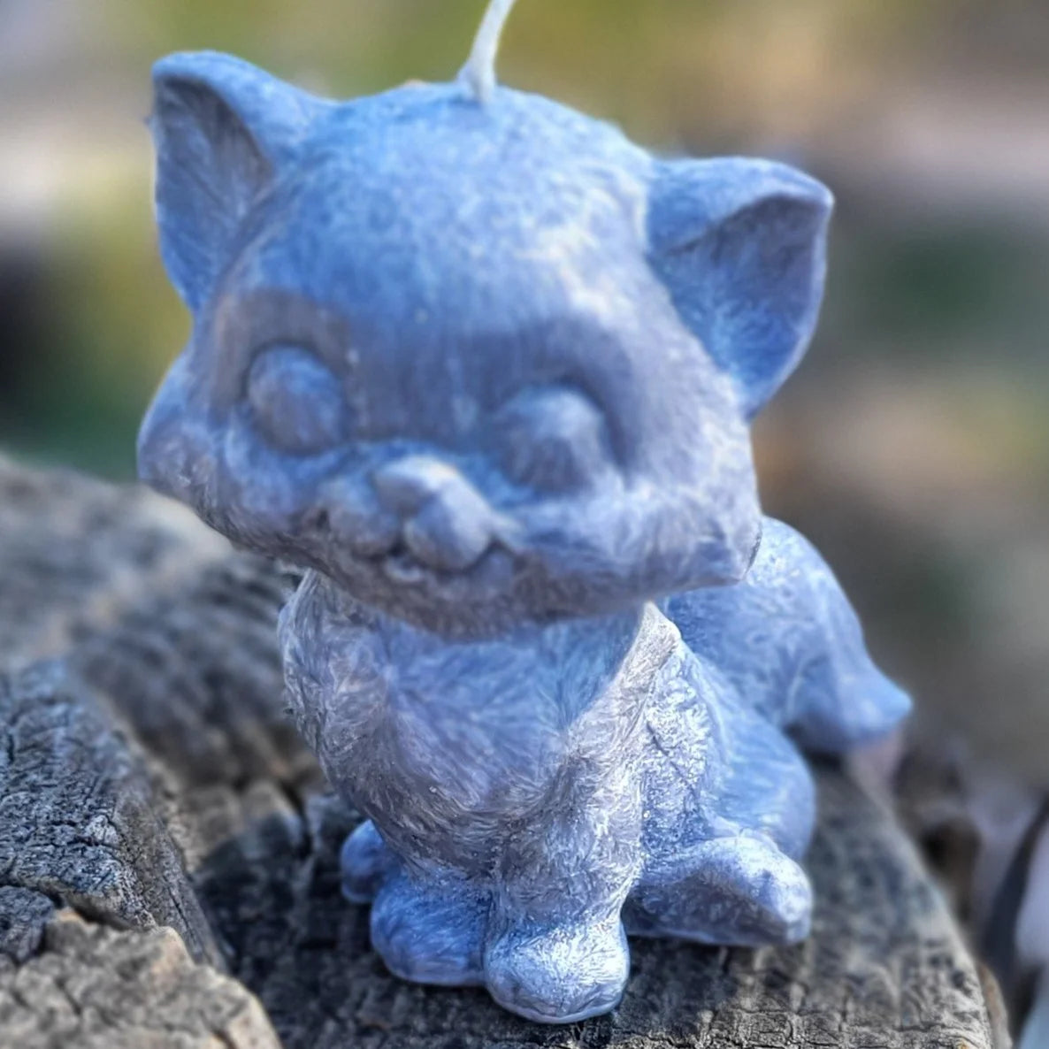Black Palmwax cat candle on tree stump