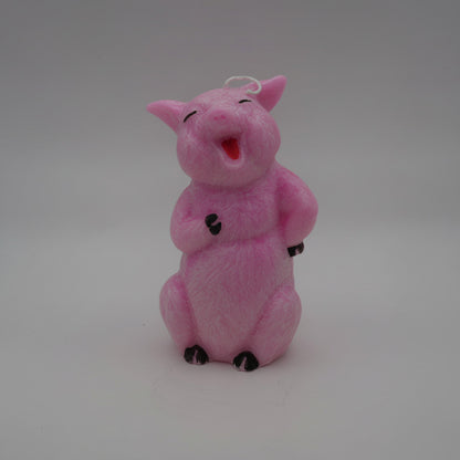 happy pig candle on a gray background