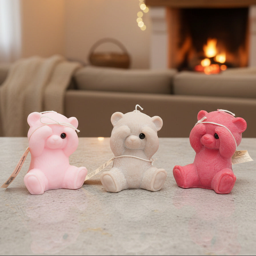 3 peek-a-boo teddy bear candles on a counter in a livingroom