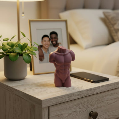 a brown male torso candle on a night stand