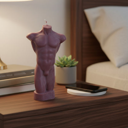 a brown male torso candle on a nightstand
