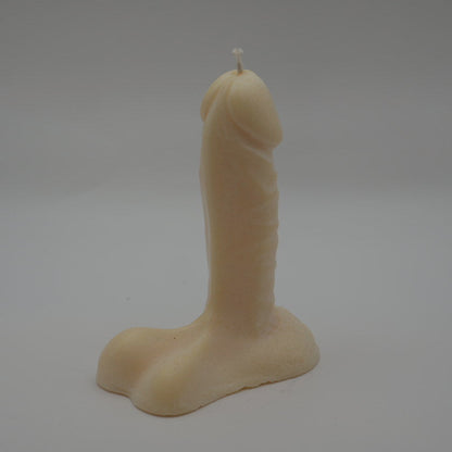 natural colored 6 inch penis candle with light grey background