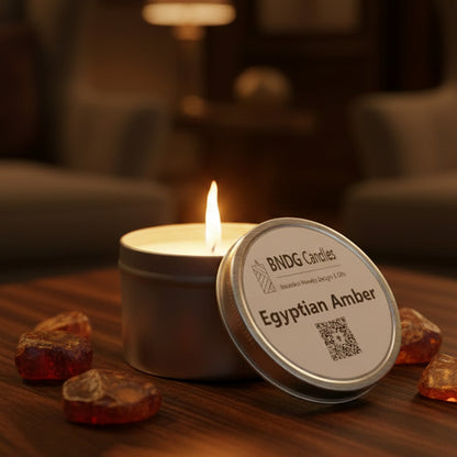 Lit candle tin on a table with amber pieces