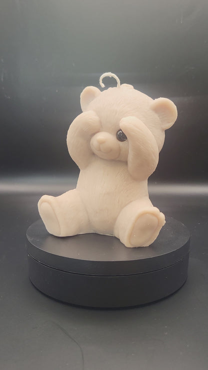 peek-a-boo teddy bear on a spinning platform